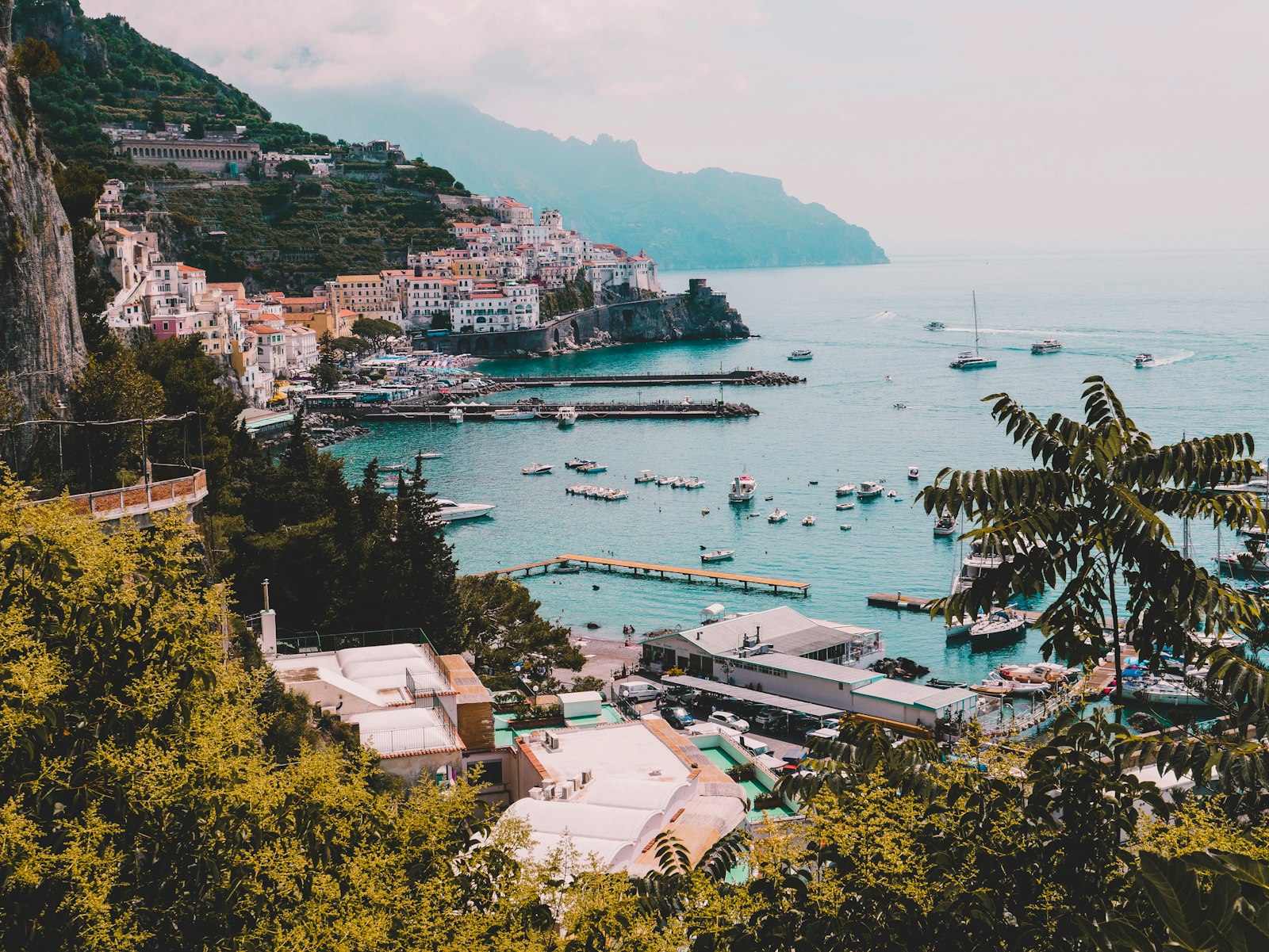 Aerial view of Amalfi's harbor and hillside town on Italy's Amalfi Coast